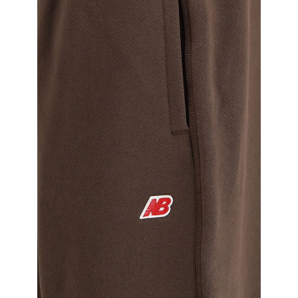 New Balance Brown Cotton Joggers (Workout Pants) with logo patch and elasticated waistband, AW25 collection.