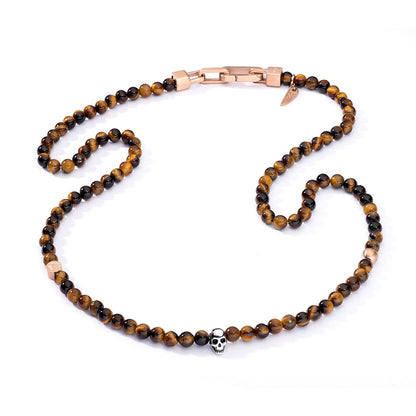 AN JEWELS JEWELRY Mod. AA.C255RBR elegant beaded necklace with skull detail, featuring tiger eye stones and rose gold clasp.