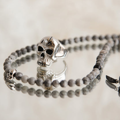 AN JEWELS JEWELRY Mod. AA.R255S-12 skull ring with stone beads on a bracelet.