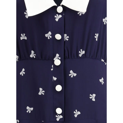 Close-up of Alessandra Rich Blue Silk Casual Dress with bow pattern and wide collar.