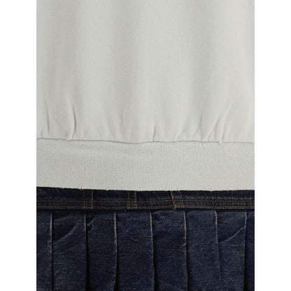 Close-up of Balenciaga Multicolor Cotton Sweatshirt with denim pleated skirt and ribbed hem detailing.