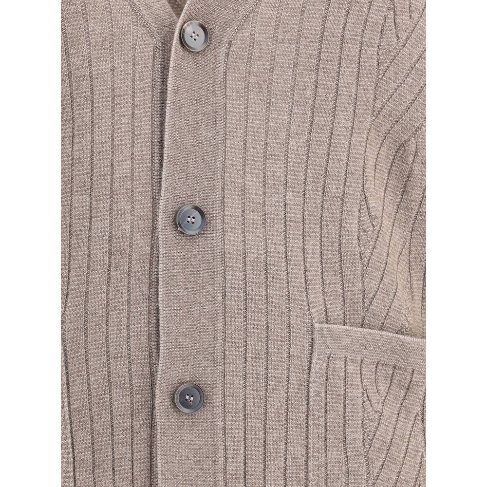 Close-up of Brioni Brown Wool Cardigan with V-neckline, button closure, ribbed design, and patch pockets for AW25 season.