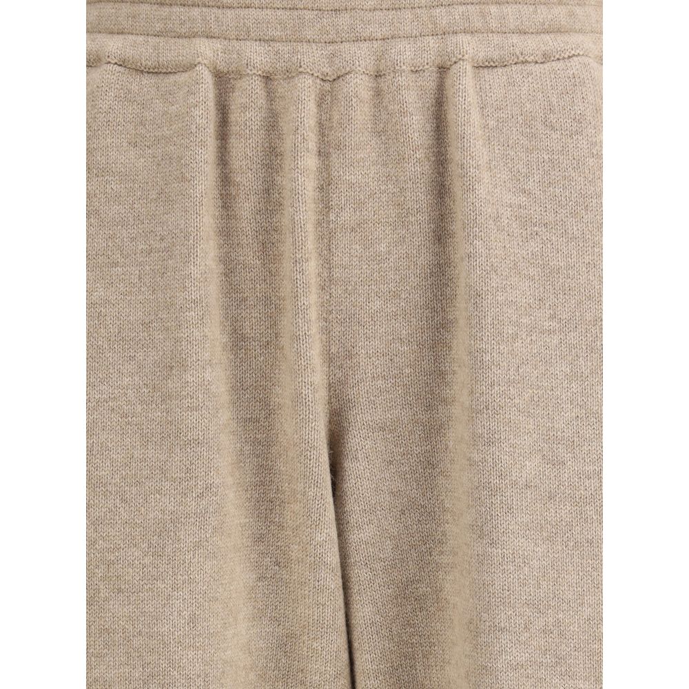 Close-up of Brunello Cucinelli Beige Cashmere Pants with elastic waistband and tapering silhouette, showcasing luxurious kashmir fabric.