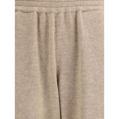 Close-up of Brunello Cucinelli Beige Cashmere Pants with elastic waistband and tapering silhouette, showcasing luxurious kashmir fabric.