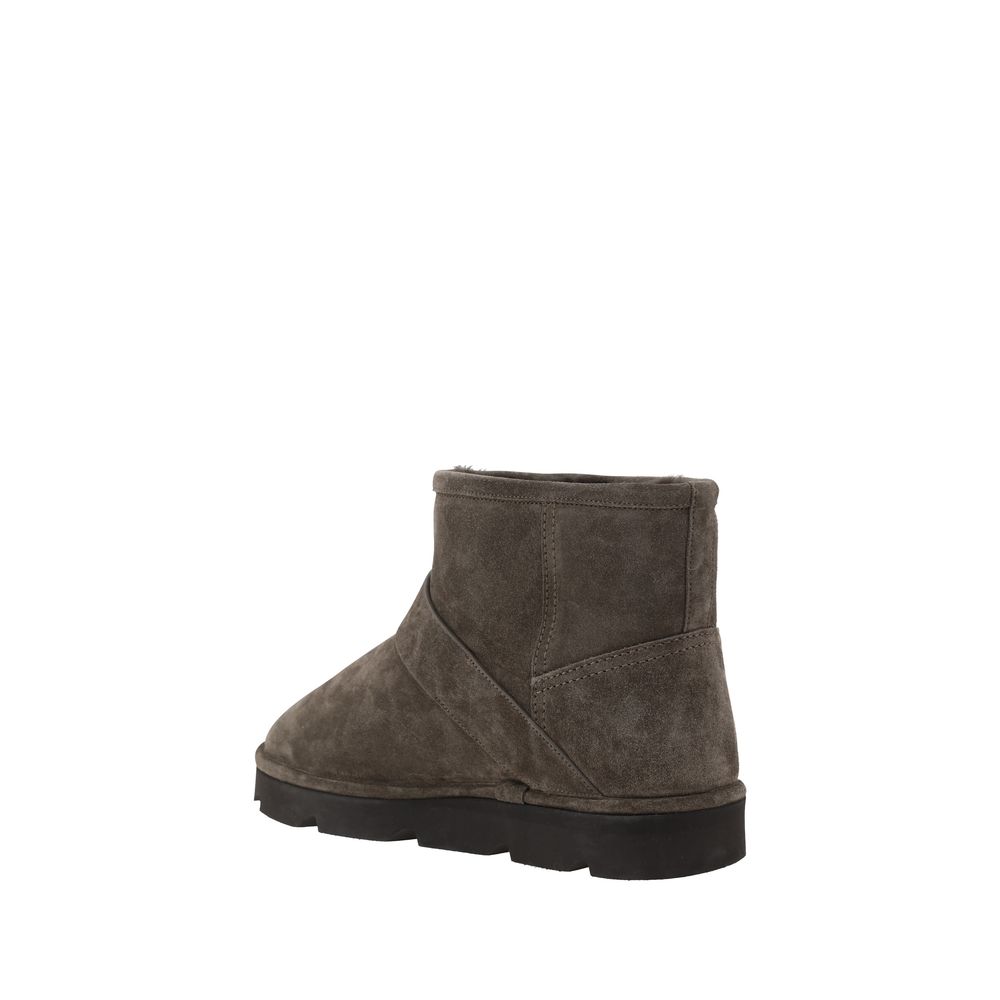 Brunello Cucinelli Brown Calf Leather Bos Taurus Ankle Boots with knurled sole, adjustable buckle detail, and rounded toe for comfort.