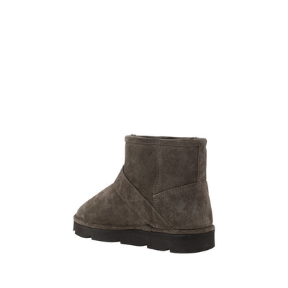 Brunello Cucinelli Brown Calf Leather Bos Taurus Ankle Boots with knurled sole, adjustable buckle detail, and rounded toe for comfort.
