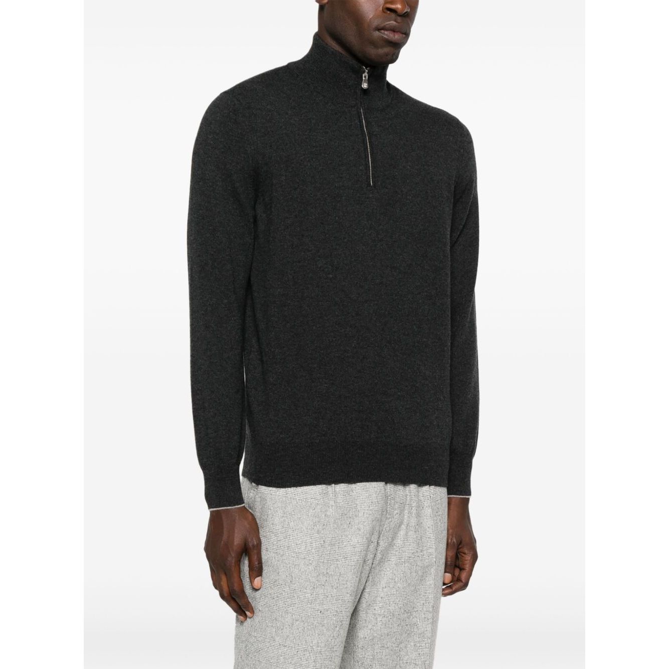 Brunello Cucinelli Cashmere sweater in grey with half zip front, long sleeves, ribbed cuffs and hem, high neck, and curved hem design.