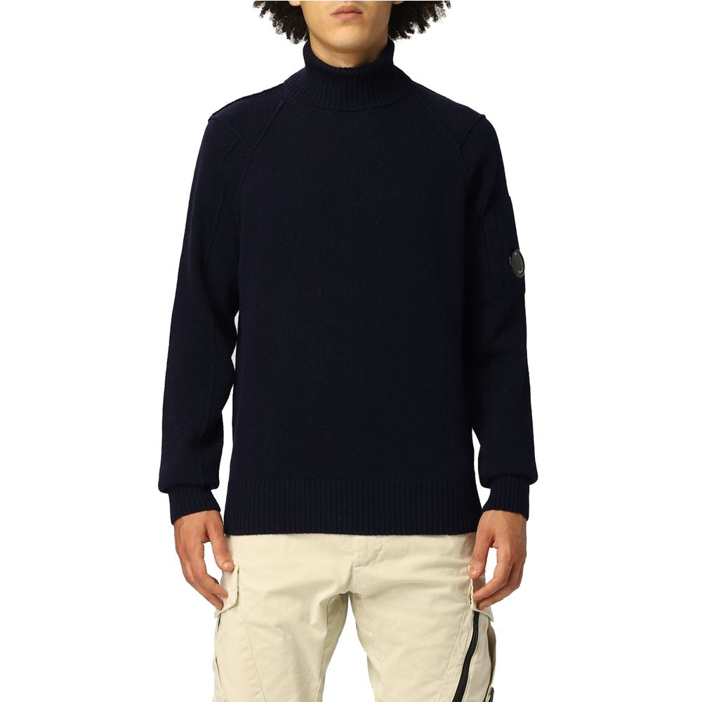 C.P. Company Blue Wool Sweater with ribbed turtleneck collar, ribbed cuffs and hem, featuring a logo plaque on the shoulder.