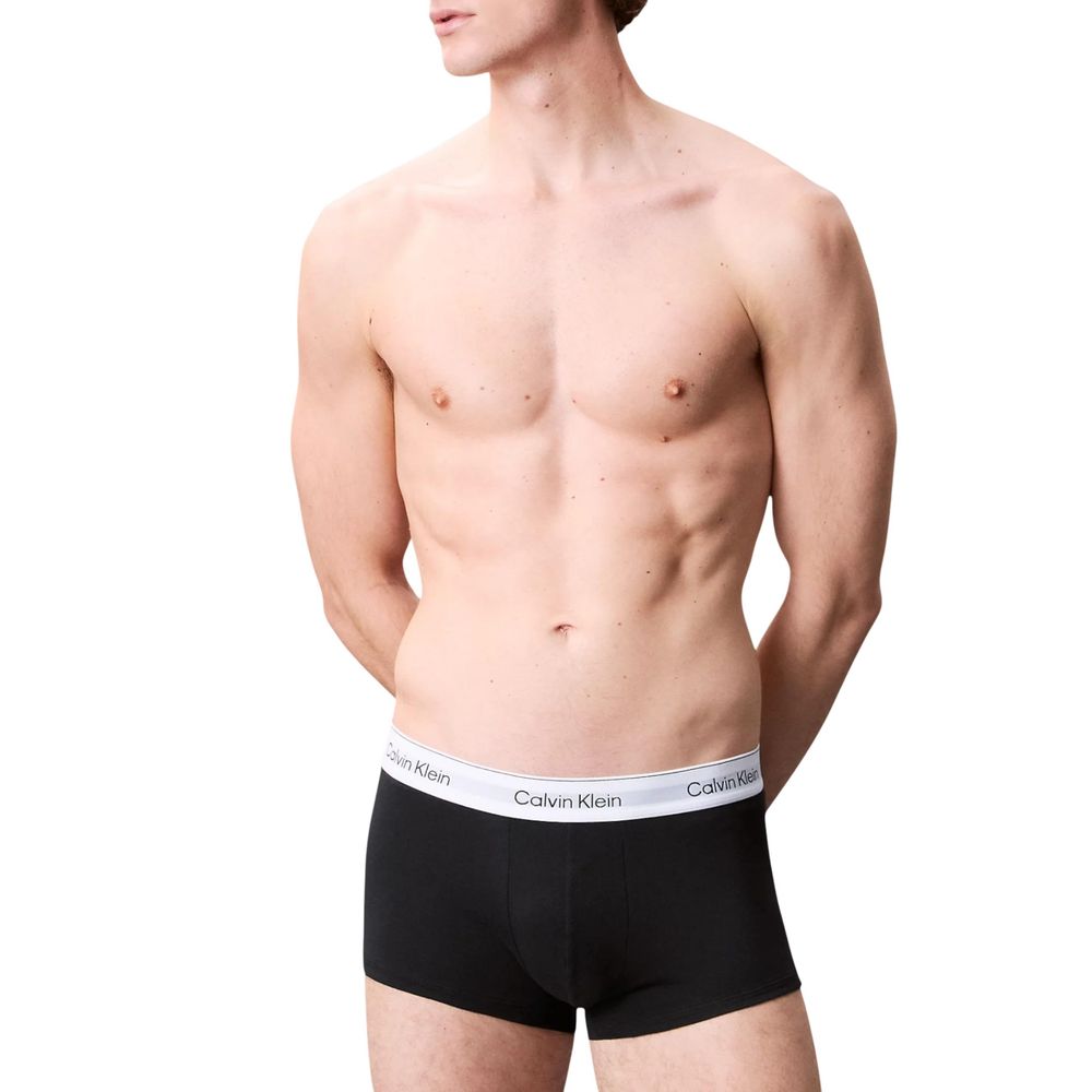 Model wearing Calvin Klein Underwear Black Cotton Boxer showcasing low-rise trunk and logo waistband.