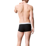 Man wearing Calvin Klein Underwear Black Cotton Boxer, showcasing a modern low-rise design with a logo waistband.