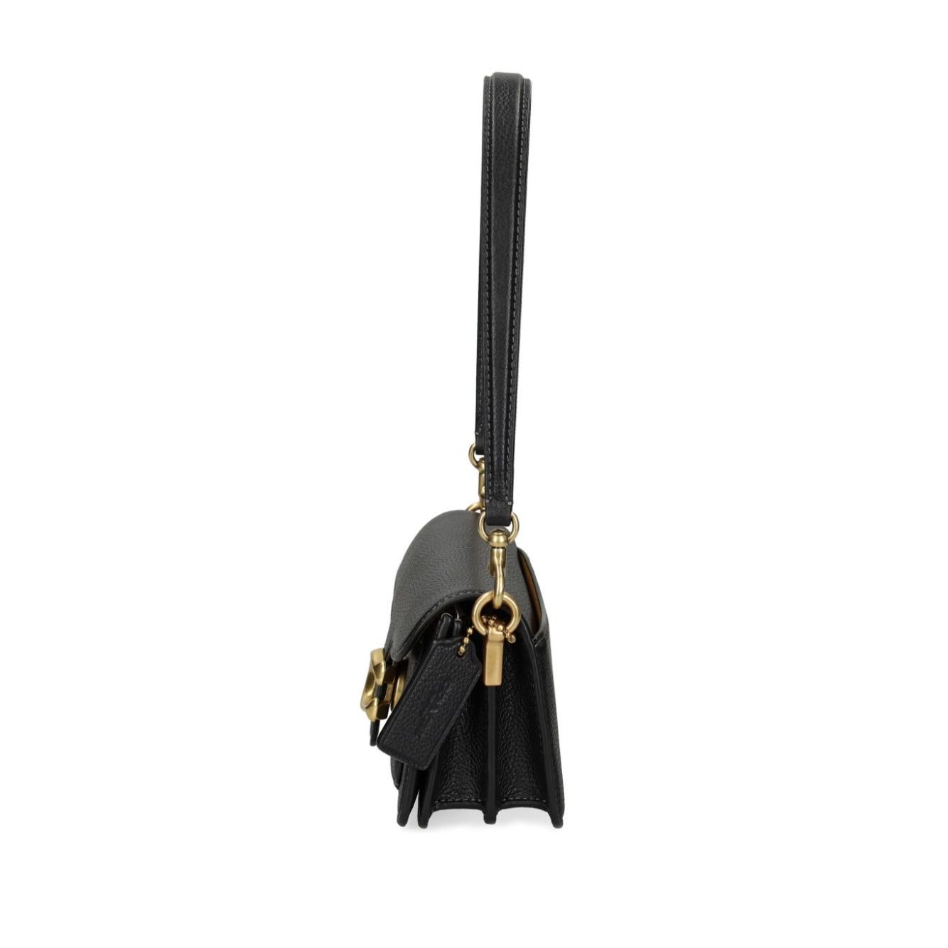 Side view of Coach Tabby 20 leather crossbody bag with removable strap and fabric lining.