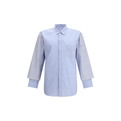 Comme Des Garçons Light Blue Cotton Pattern Shirt with subtle stripes and double cuffs for a sophisticated and contemporary look.