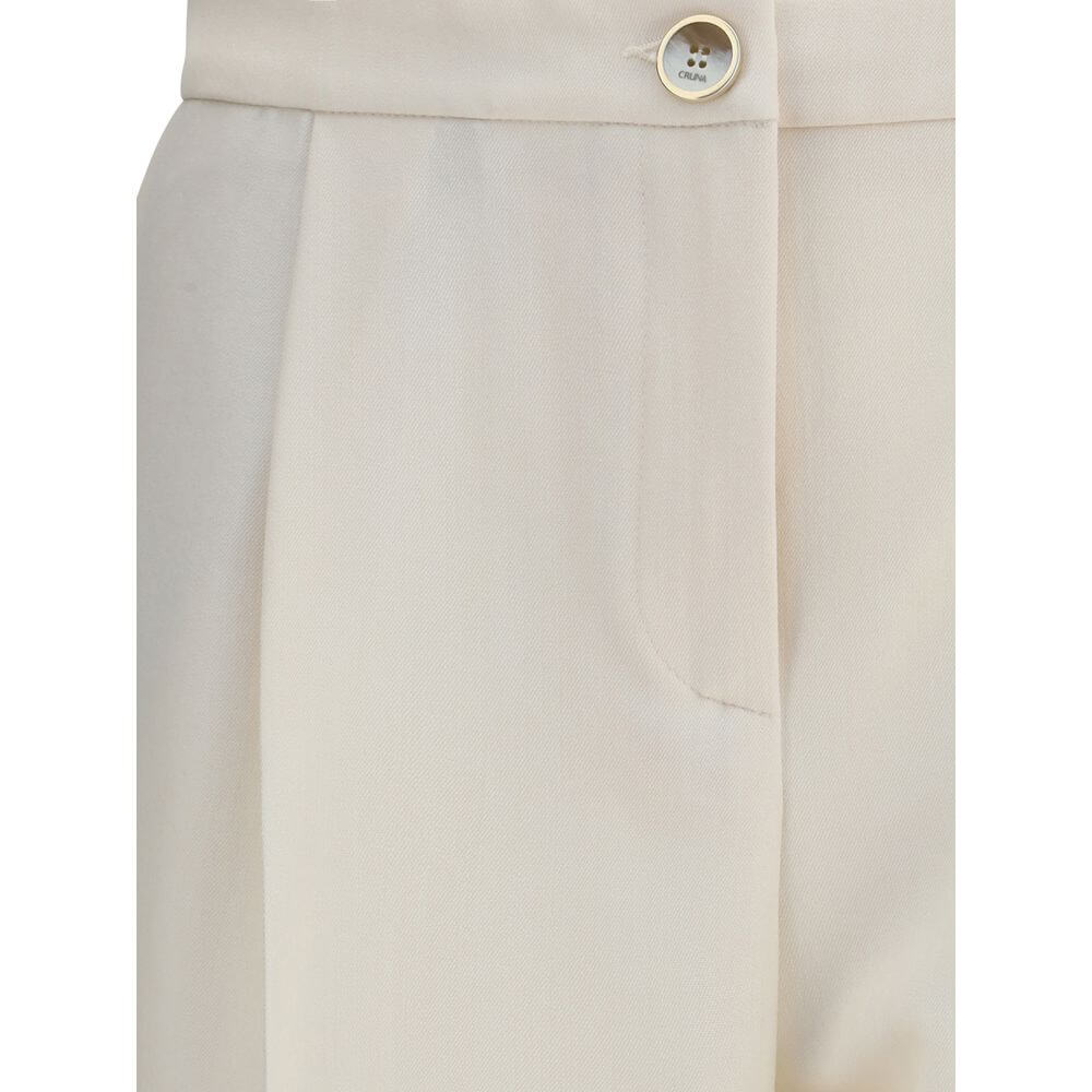 Close-up of button and fabric on Cruna Cream Polyester Casual Pants with wide leg design and modern silhouette.