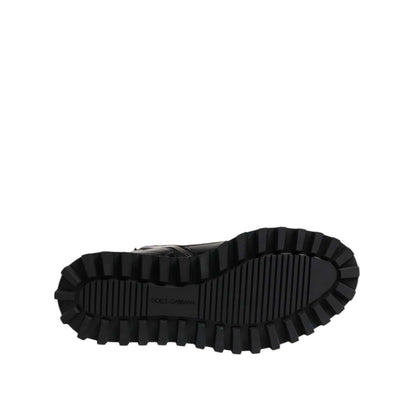Sole view of Dolce & Gabbana Black Leather Lace Up Mid Calf Boots Shoes featuring rugged tread and logo detail.