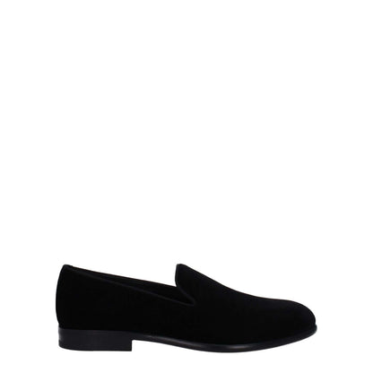 Dolce & Gabbana Black Velvet Slip-On Loafers with leather sole and low flat heel, featuring a stylish round toe design.