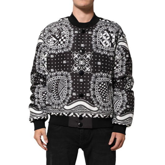 Dolce & Gabbana Black White Bandana Print Bomber Jacket with ribbed cuffs and button closure, modeled for a streetwear look.
