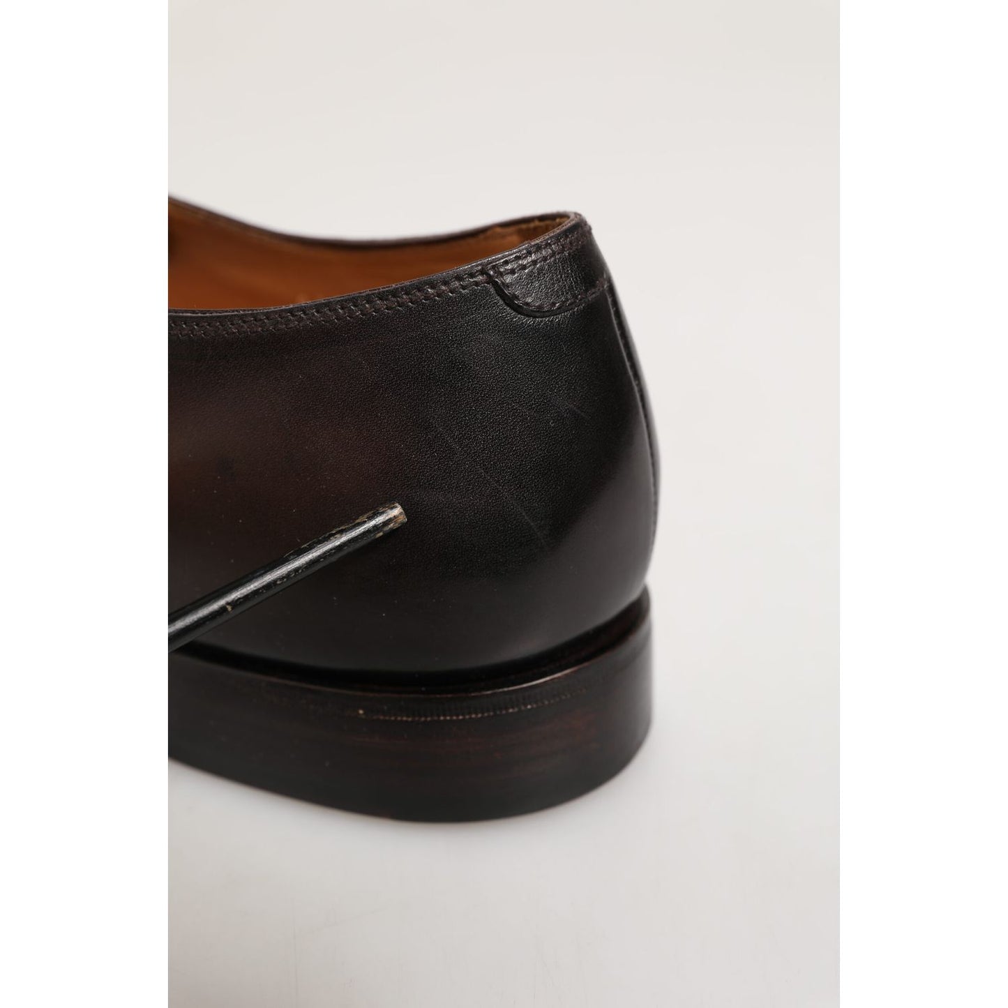 Close-up of Dolce & Gabbana Brown Leather Lace Up Dress Men Derby Shoes heel detail, highlighting craftsmanship and leather quality.