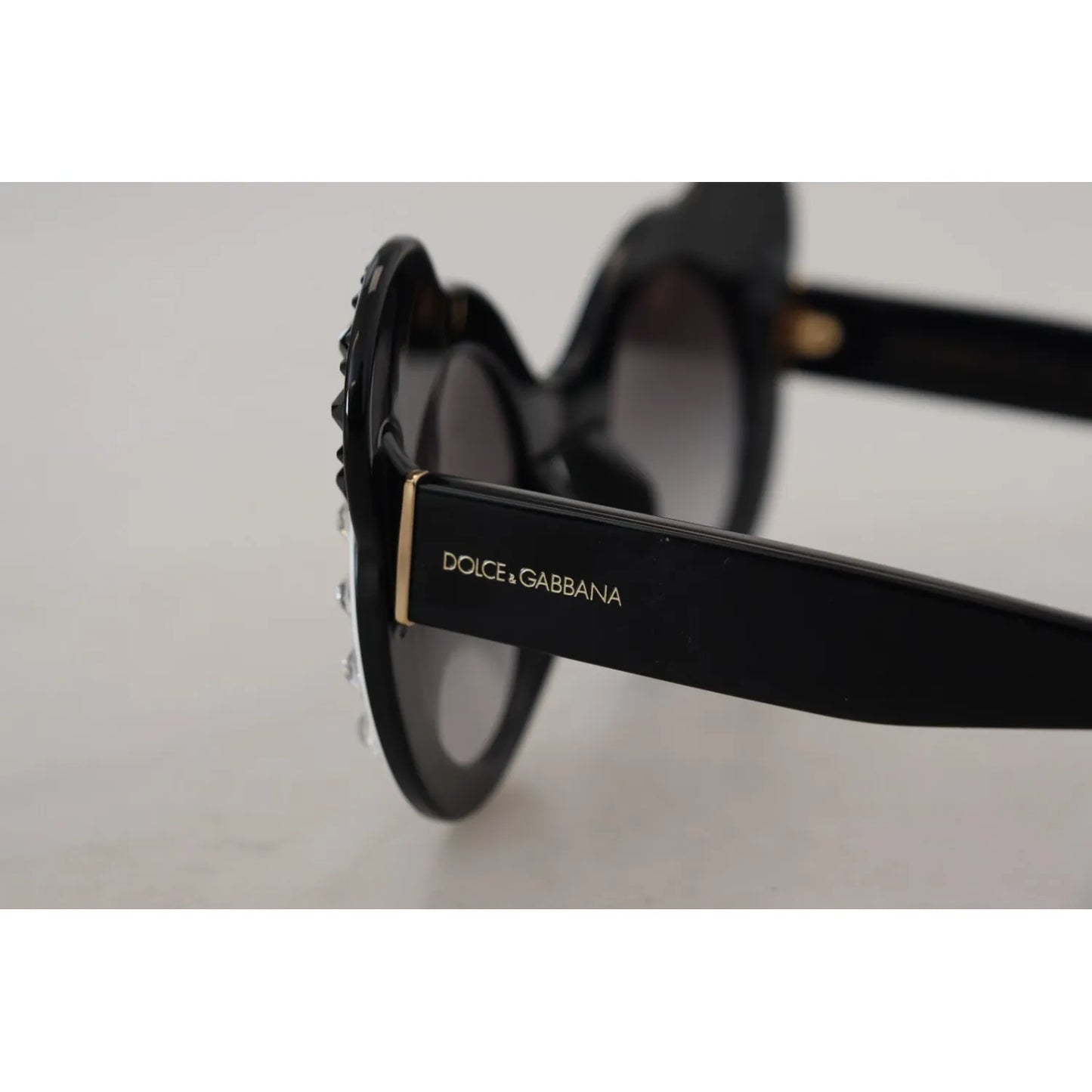 Side view of Dolce & Gabbana DG4325BM White Black Acetate Crystal Shades Sunglasses with gray lenses and minor defect visible.