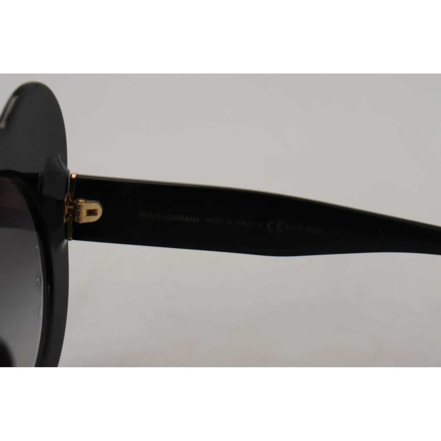 Side view of Dolce & Gabbana DG4325BM White Black Acetate Crystal Shades Sunglasses with minor defect, missing stones visible.