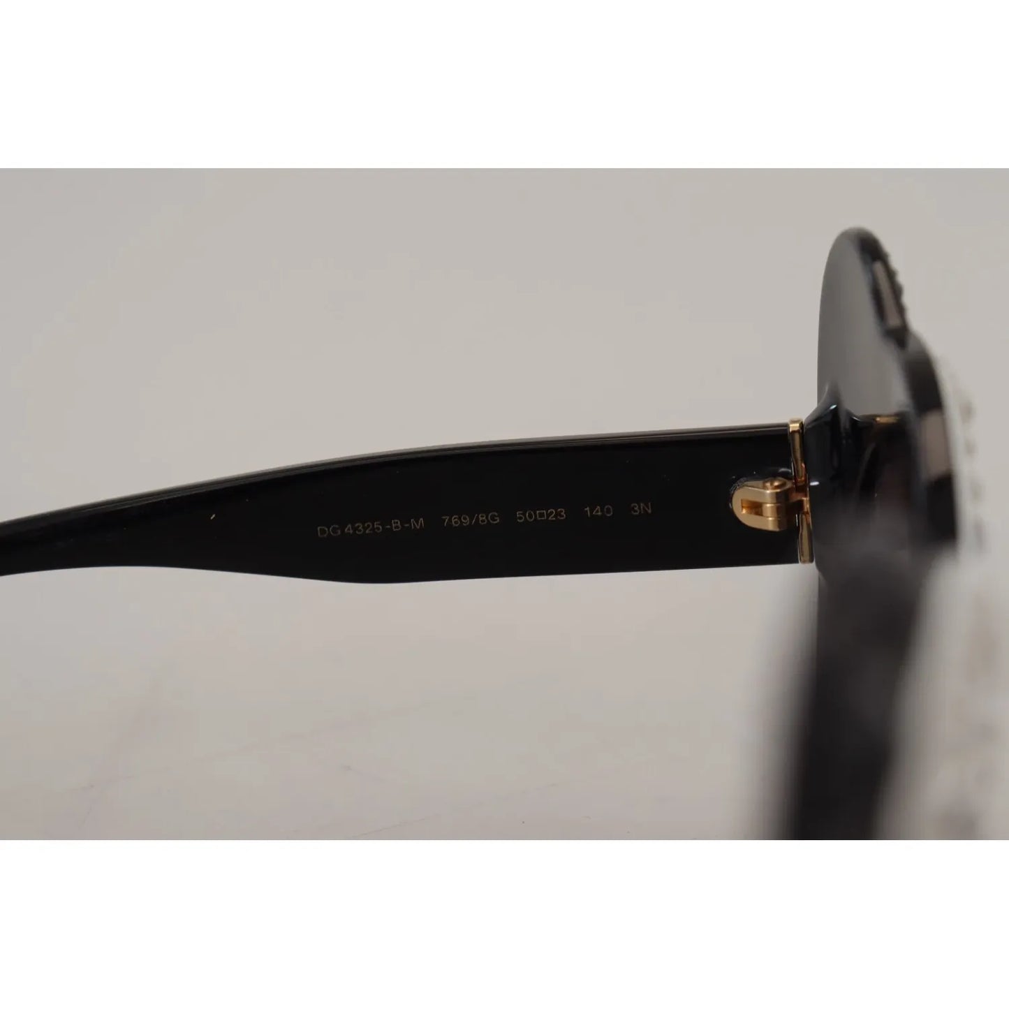 Close-up of Dolce & Gabbana DG4325BM White Black Acetate Crystal Shades Sunglasses frame detail.