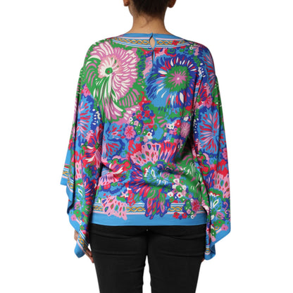 Woman wearing Dolce & Gabbana Multicolor Floral Print Silk Blouse Tunic Top, showcasing vibrant floral design.
