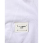 Close-up of label on Dolce & Gabbana White Collared Short Sleeves Polo T-shirt, 100% cotton, shows minor defects, branded fashion.