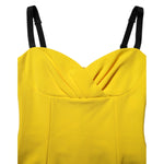 Close-up of Dolce & Gabbana Yellow Polyester Sleeveless Sheath Midi Dress bodice with black straps.