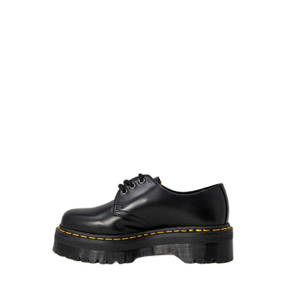 Dr. Martens Black Leather Lace-Up Boots with thick flat sole for added comfort and durability, side view against white background.
