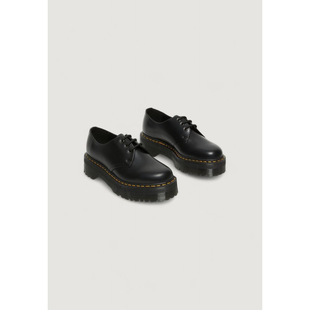 Dr. Martens Black Leather Lace-Up Boots with thick sole, showcasing iconic style and durability for versatile women’s footwear.