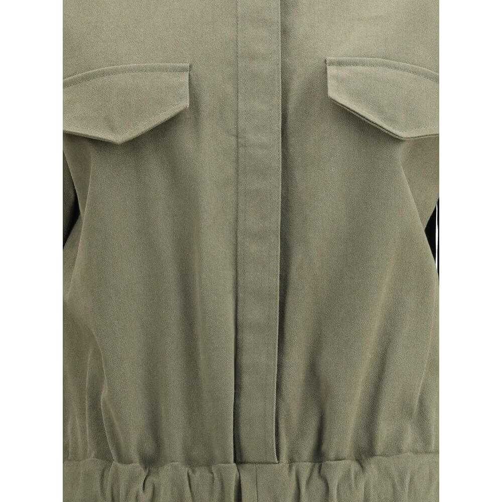 Close-up of Ella Green Cotton Jumpsuit showing concealed buttons and welt pocket flaps for style and functionality.