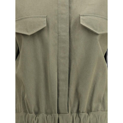 Close-up of Ella Green Cotton Jumpsuit showing concealed buttons and welt pocket flaps for style and functionality.