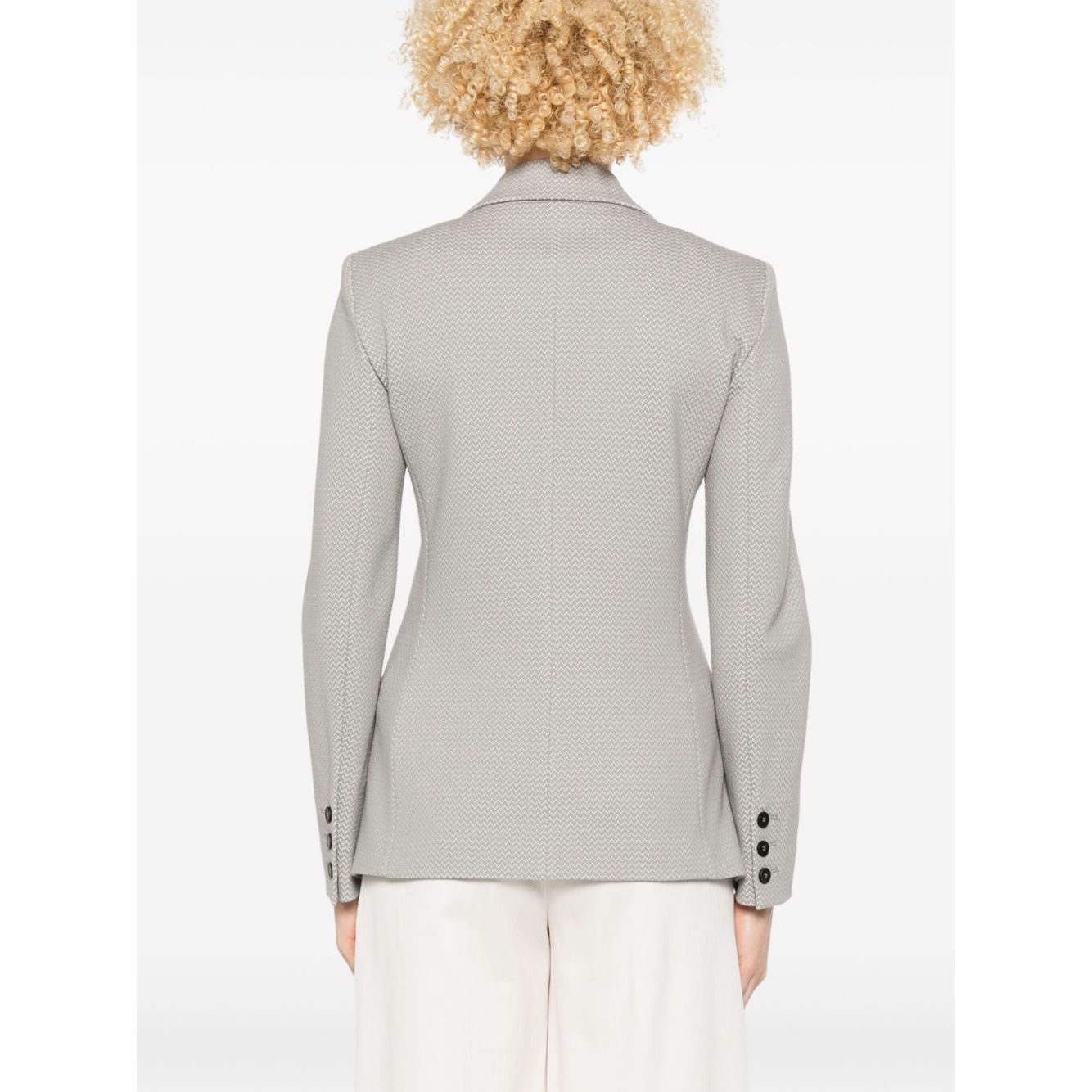 Back view of Emporio Armani Icon Blazer in light grey with buttoned-cuff sleeves and shoulder pads, shown in model wearing size 40 (IT).