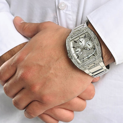 Gent wearing GUESS Mod. GW0094G1 wristwatch with silver analog design, quartz movement, and mineral dial
