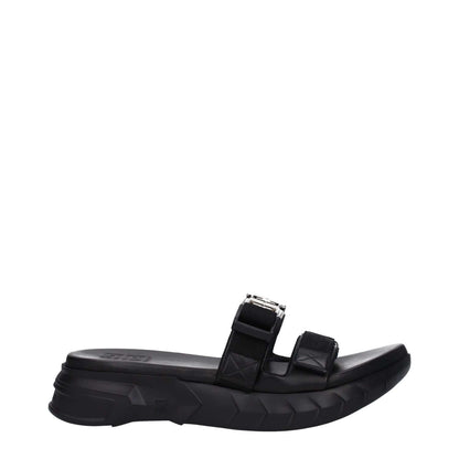 Givenchy Black Fabric Slippers featuring open toe and mid heels, silver logo, rubber sole, and clip closure.