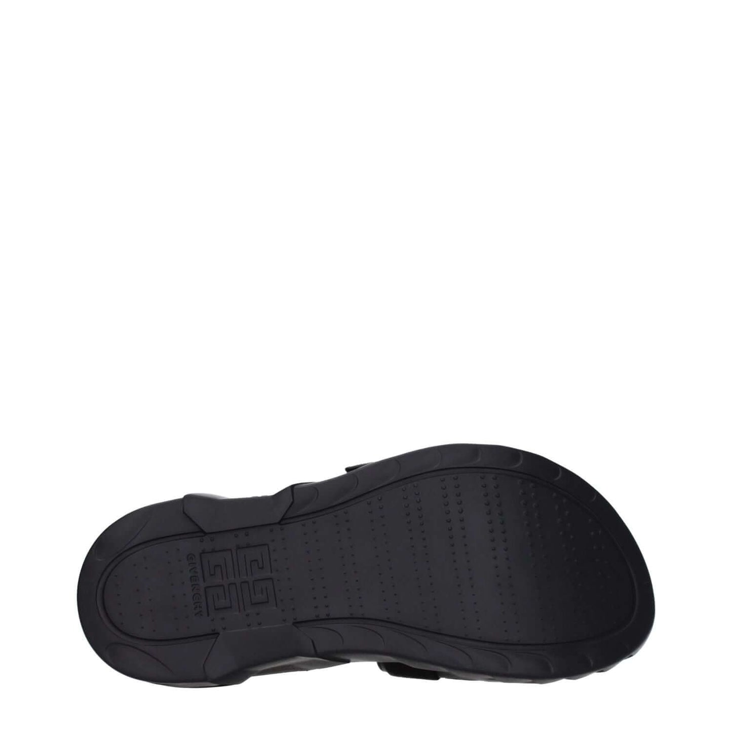 Sole of Givenchy Black Fabric Slippers with rubber material and logo imprint, showcasing open toe and mid heels for elegant style.