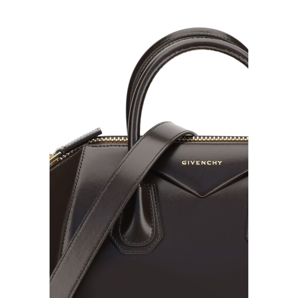 Close-up of Givenchy Brown Calf Leather Bos Taurus Handbag with logo and strap details.