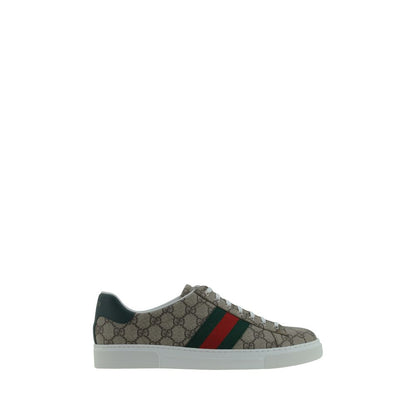 Gucci Beige Rubber Low Top Sneakers with GG jacquard fabric, lace-up closure, and branded logo detail on leather back and tongue.