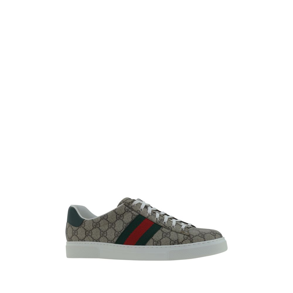 Gucci Beige Rubber Low Top Sneakers with GG jacquard, leather back logo, and platform sole. Featuring iconic brand monogram on tongue.