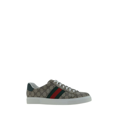 Gucci Beige Rubber Low Top Sneakers with GG jacquard, leather back logo, and platform sole. Featuring iconic brand monogram on tongue.