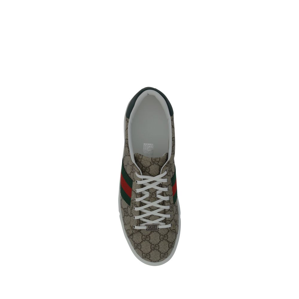 Top view of Gucci Beige Rubber Low Top Sneakers with GG jacquard fabric and iconic monogram on tongue.