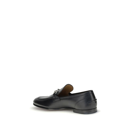 Gucci Black Calf Leather Bos Taurus Slip-On Loafers with iconic Morsetto detail, side view showcasing elegant silhouette.