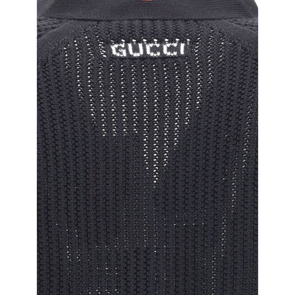 Back detail of Gucci Black Cotton Cardigan featuring knit weave and Gucci logo, showcasing texture and branding.