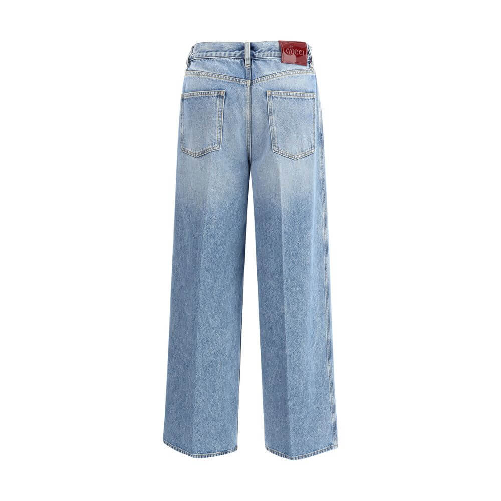 Back view of Gucci Light Blue Cotton Jeans Denim with wide legs and contrast stitching, featuring square back pockets and a vintage light wash.