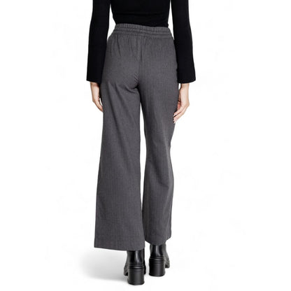 Back view of Jacqueline De Yong Gray Cotton Casual Pants on model, showcasing high-waisted palazzo cut and soft fabric blend.