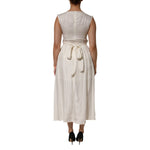 Back view of model wearing L'Autre Chose Ivory White Sleeveless Maxi Cupro Viscose Dress with a draped waist and flowing silhouette.
