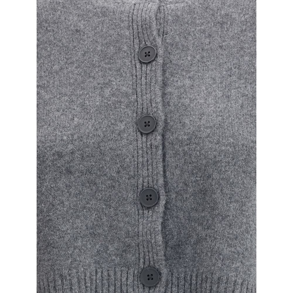 Close-up of Loulou De Saison Gray Cashmere Cardigan with button closure, featuring ribbed hem, showcasing texture and style details.