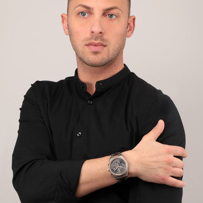 Man wearing MASERATI MOD. R8853100020 wristwatch with silver and rose gold two-tone design, showcasing style and elegance.