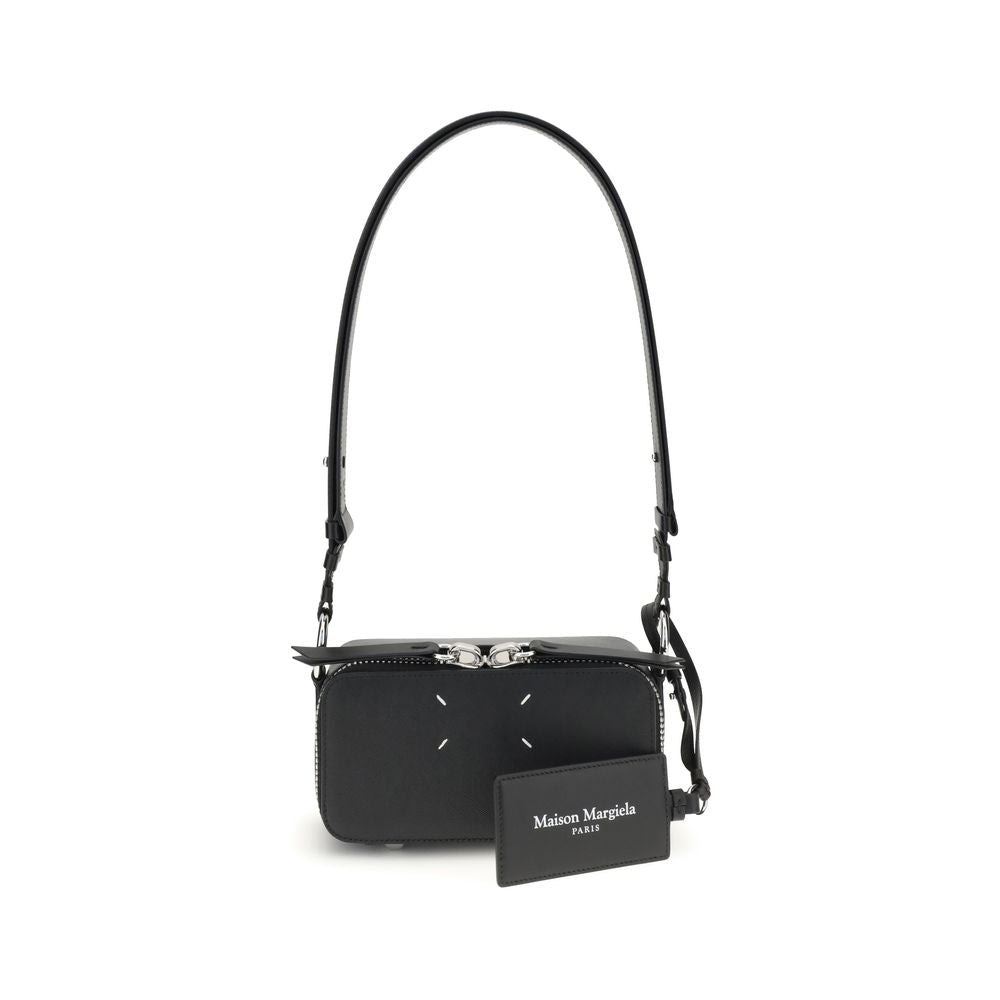 Margiela Black Calf Leather Bos Taurus Shoulder Bag with four-stitch logo and adjustable strap, displayed in front view.