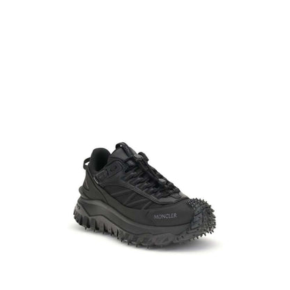 Moncler Black Calf Leather Bos Taurus Athletic Sneakers with reflective inserts and logo accents for style and performance.