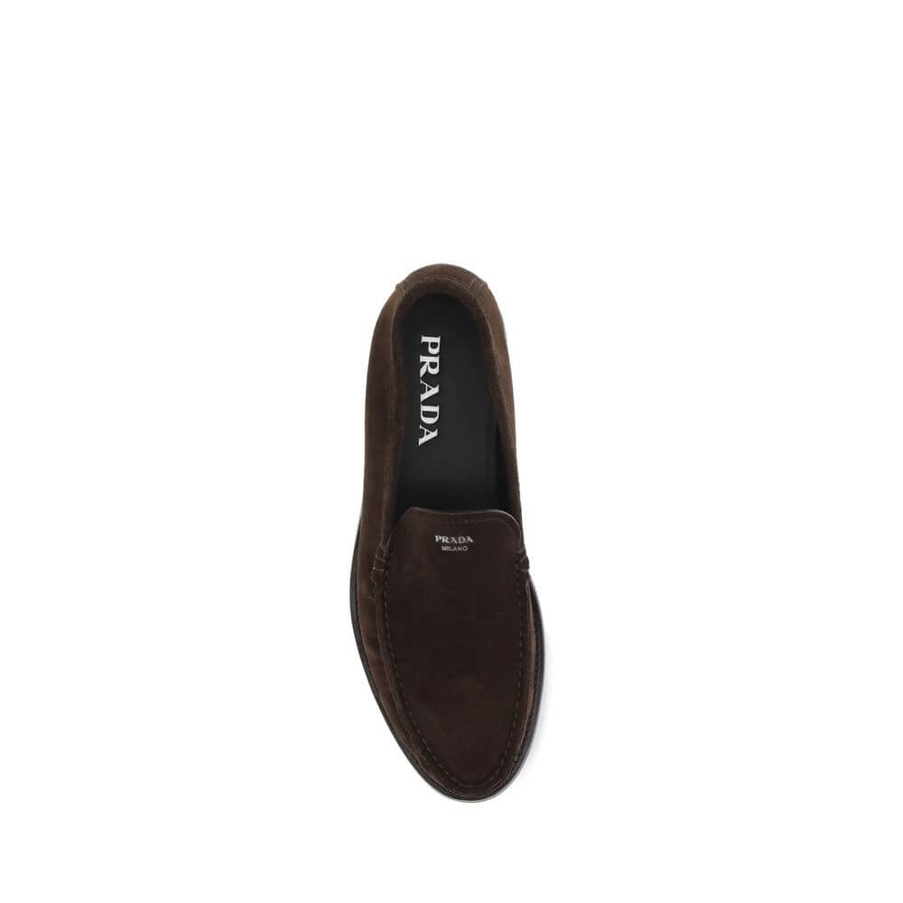 Prada Brown Calf Leather Bos Taurus Slip-On Loafers top view with logo and suede finish on rubber sole.